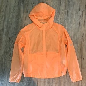 Nike Lightweight rain jacket. Orange. Brand new condition size small! Very cute!